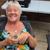 Sandra Adams, described as "a true character", has been left paralysed from the neck down after a fall down the stairs.