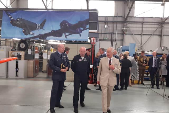 The King visits a hangar where veterans are having a tea party.