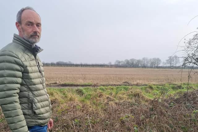 No Pylons Lincolnshire campaigner Peter Phillips at a field in Burgh le Marsh that could be a site for pylons.