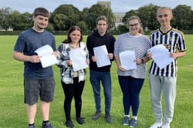 Bailey Faulkner, Lacey Newton, Jamie Monks, Gabriella Bedford and Hubert Bulkowy collect their results at the Giles Academy, Old Leake.