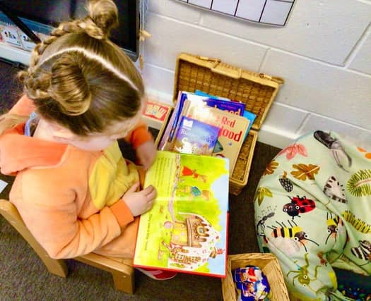 In the reading corner enjoying a book