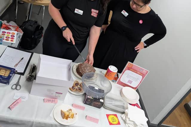 Charlotte Clarke & Kerry O’Neill cake cutting at the Afternoon Tea event.