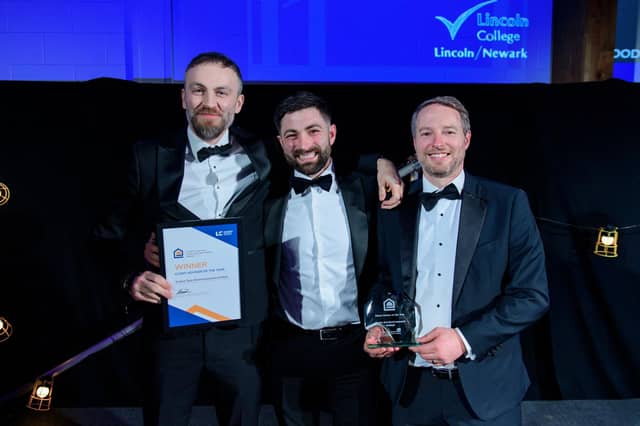 Evolve Geo-Environmental’s Paul Huteson (left) and Paul Bennett (Right) receive the Client Advisor of the Year Award from Jasper Cauldwell (centre) of Wood Moore