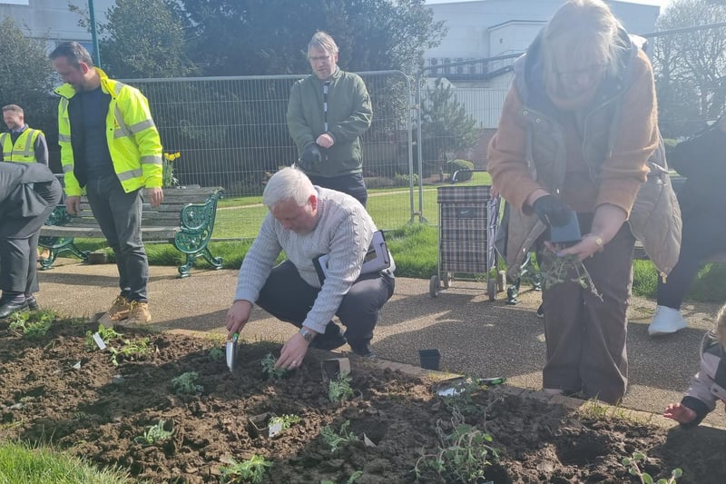 Town clerk Steve Larner (centre) helping with the planting.