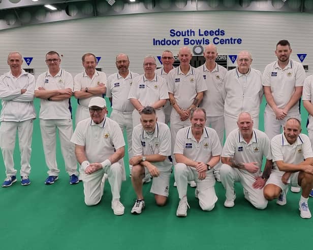 The Denny Plate team are pictured with national umpire Les Smith.