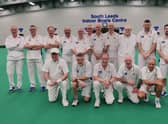 The Denny Plate team are pictured with national umpire Les Smith.