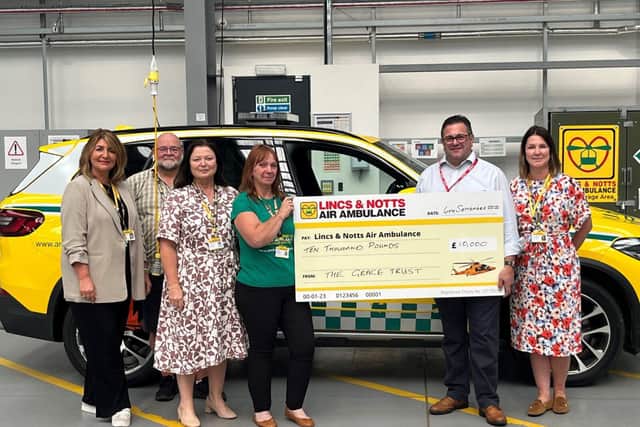LNAA Volunteers receiving donation from The Grace Trust