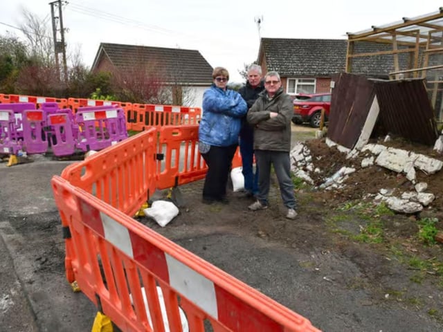 Hannah McKinlay and Graham Pearson (centre) with fellow resident Neil Allen, following the 2022 collision at Hall Corner.