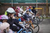 Children learn cycle skills on the playground during Level 1