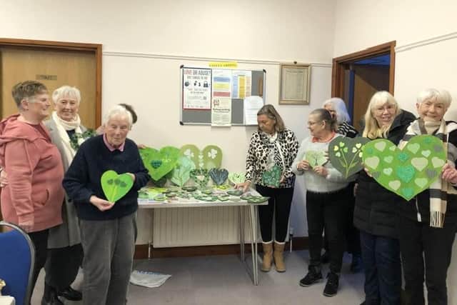 Members of Sutton on Sea WI sharing their green hearts.