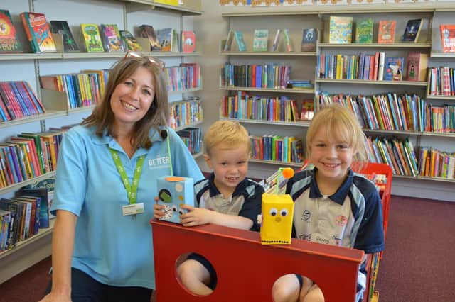 Library manager Kay Turnbull with young 'Gadgeteers' Jack (3) and Penny (6) Dobson