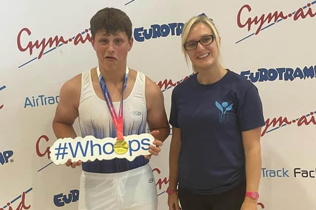 Leo Bovington with his medal and coach Stephanie Osborn.