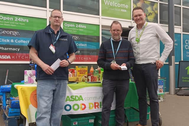 A scene from the food drive, with Andy Bradley, Boston Foodbank volunteer, Bob Wagstaff, Boston Foodbank manager, and Sam Johnson, general store manager of Asda Boston.