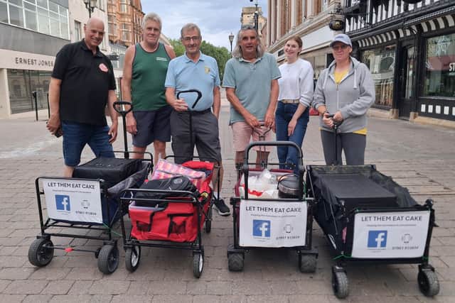 Let Them Eat Cake volunteers feeding the homeless in Lincoln. Co-ordinator Graham Foster is on the far left Credit: LDRS