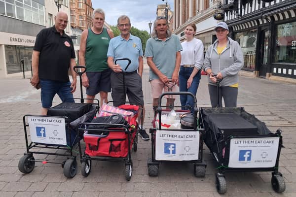 Let Them Eat Cake volunteers feeding the homeless in Lincoln. Co-ordinator Graham Foster is on the far left Credit: LDRS