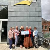 Rolling Scones committee members presented the money to theatre manager Tracey Mackenzie (centre). Image Paula Burrett