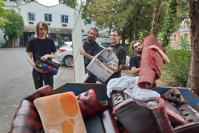 The team having to throw out many items due to flooding.