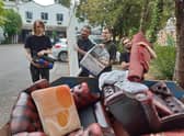 The team having to throw out many items due to flooding.