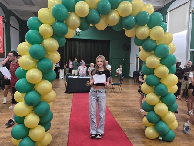 Brooke with her results in the main hall.
