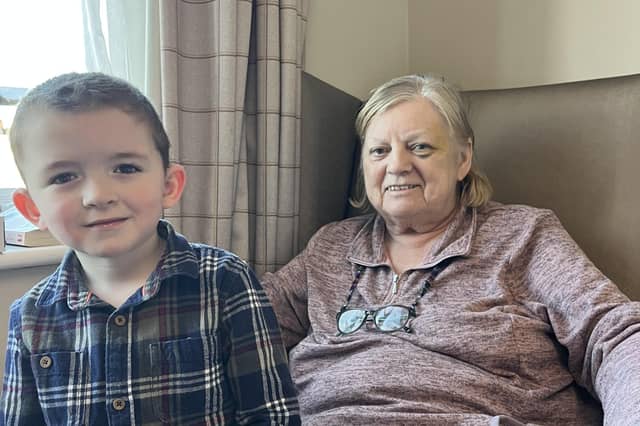 Rosalind Armiger, now in a care home, with one of her grandchildren, Arthur, aged four.