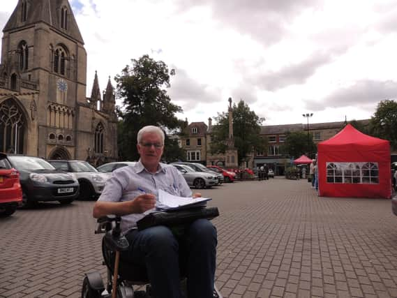 Anthony Henson gathering signatures for his petition in Sleaford Market Place.