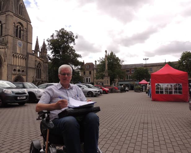 Anthony Henson gathering signatures for his petition in Sleaford Market Place.