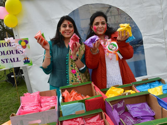 Megha Valecha and Poonam Panjwani man the coloured powders stall at Boston's Central Park.
