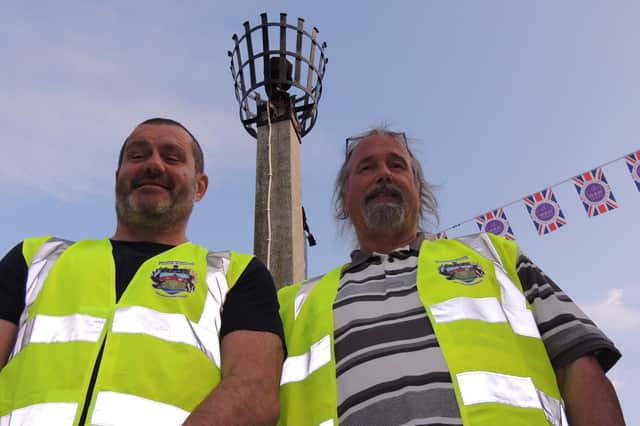 The main jubilee beacon could be lit at Metheringham after a dove nested in it, pictured here with parish councillors Dave Parry and Keith Parker (chairman).