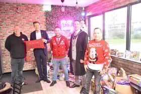 Volunteers with MP Richard Tive and Mayor Coun Adrian Findley at The Hideout Cafe and Bar. Credit: Barry Robinson
