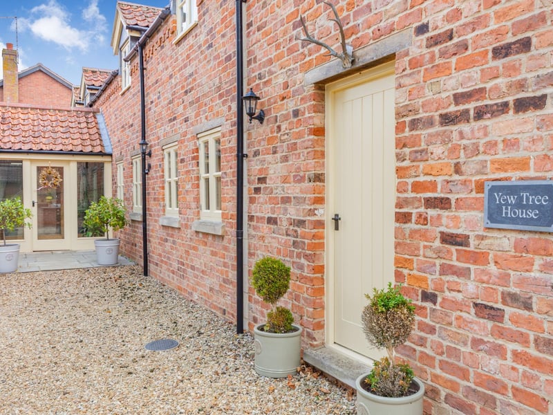 The front door in the distance and access to the potential annexe to the right.