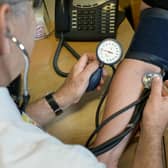 A GP checking a patient's blood pressure. Image for illustration only.