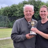 Claire Parker receives her Ladies Doubles trophy from chairman Phil Green.