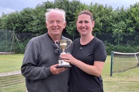 Claire Parker receives her Ladies Doubles trophy from chairman Phil Green.