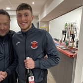Chris Rawlinson presents hat-trick hero Dec Johnson with his man-of-the-match award on Saturday. (Photo: Skegness Town FC)