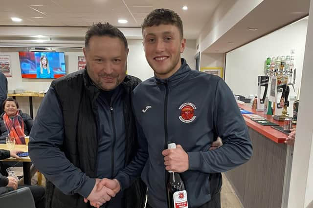 Chris Rawlinson presents hat-trick hero Dec Johnson with his man-of-the-match award on Saturday. (Photo: Skegness Town FC)