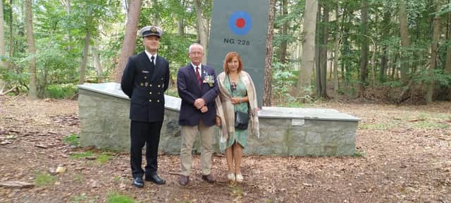 Simon Elmer (centre) at the memorial in Poland with friend Anna Stalmierska and Lieutenant Robert Dusza.