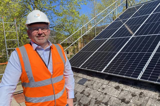 Coun Richard Wright pictured during the recent installation of more solar panels on NKDC's office roofs. Photo: NKDC