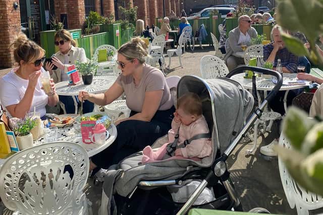 Customers dining alfresco at Caldero Lounge at Marshall's Yard