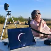 Member of East Lincolnshire Astonomy Club, Janet Patton, with a live image of the eclipse on a monitor. Photo: David Dawson