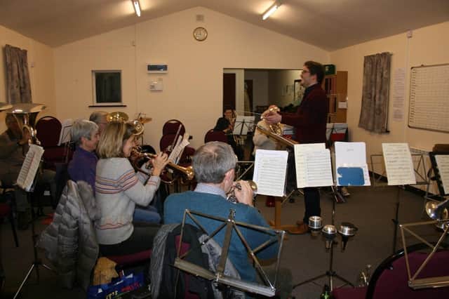 Alford Band is rehearsing for a busy festive season Josh shares a joke d with band leader Josh Wilkinson