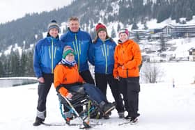Chf Tech Stu Sinclair (stood left) with other instructors and student Flt Lt Kayleigh Pierce in the sit ski. Photo: Col Nick Richardson