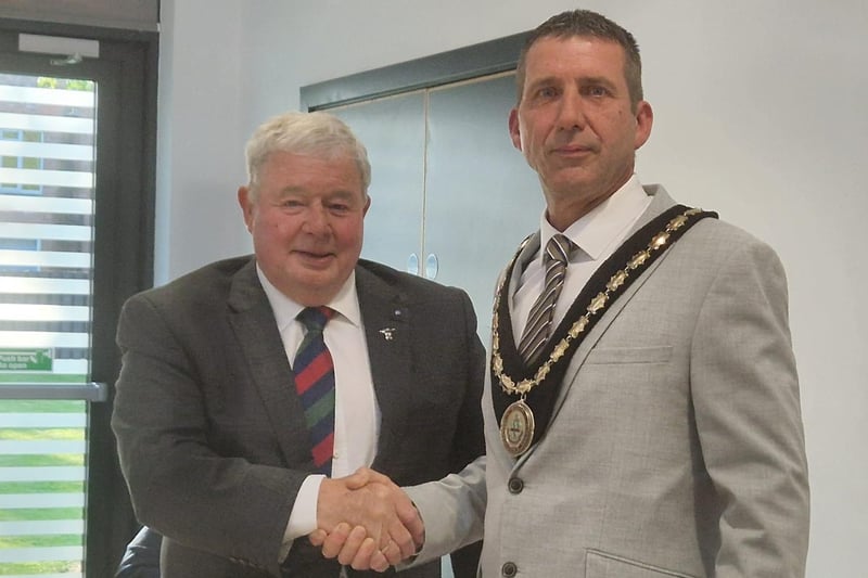 Coun Pete Barry congratulates Coun Adrian Findley on becoming Mayor.