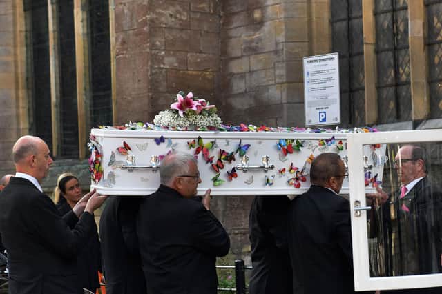 Lilia's white coffin was carried into the church by pallbearers wearing pink ties.