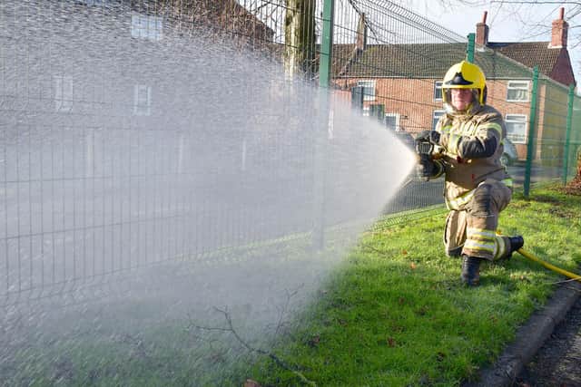 Operating the hose is firefighter Justin Clayton at Horncastle fire station.