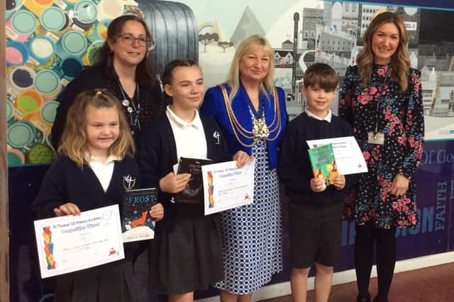 Coun Anne Dorrian, then Mayor of Boston, with St Thomas' CofE Primary School staff and Ettie Cook, of Year Three (third-place), Ruby Riggall, of Year Six (first-place), and Evan Lovelace, of Year Four, (second-place).