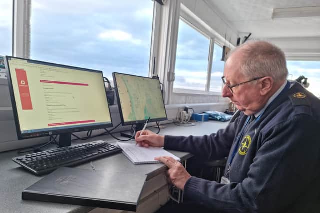 Coastwatch volunteer Tim Griffiths filling in the log book.