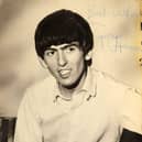 The autographed photo that George Harrison gave to one of the schoolgirls.