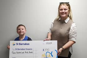 Jonah presented the money to St Barnabas Fundraising Officer Ellie Carter