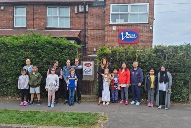 Parents and children outside the Viking School, Skegness, which has closed.