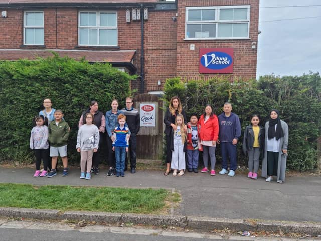 Parents and children outside the Viking School, Skegness, which has closed.